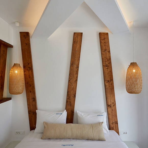 Santorini View Hotel king size bed with white and beige linen