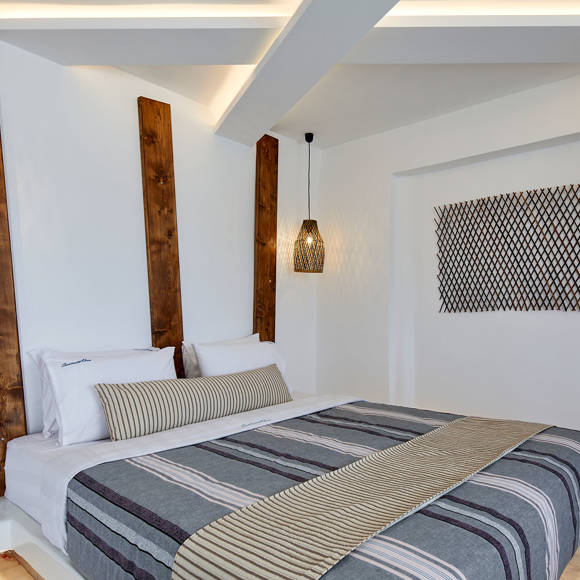 Santorini View Hotel with king size bed and striped linen