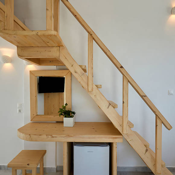 Santorini View Hotel wooden stairs and mirror and mini fridge