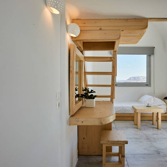 Santorini View Hotel single bed downstairs, with wooden furniture, window and air-condition