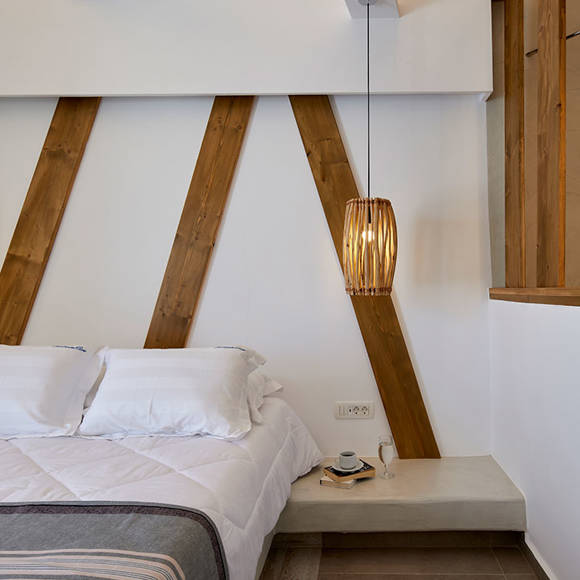 Santorini View Hotel bedroom with double bed and bamboo ceiling light