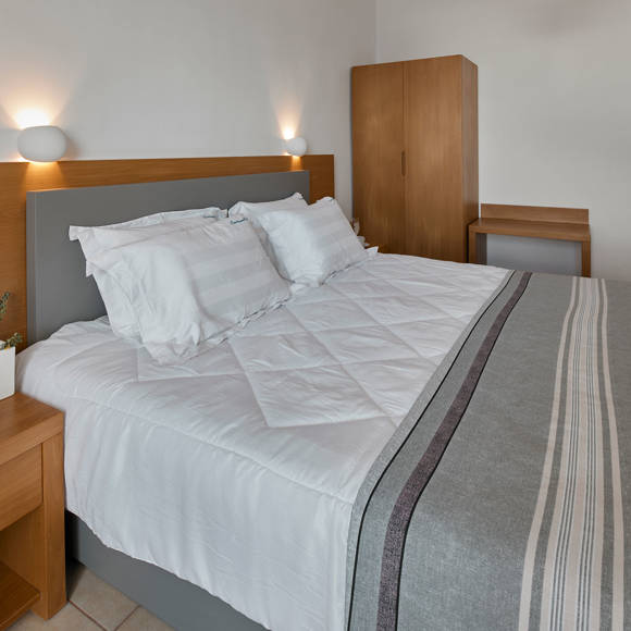 Santorini View Hotel double bed with white linen